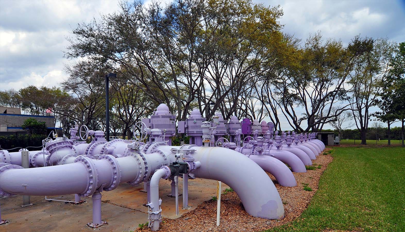 Large recycle water distribution pipes entering the ground