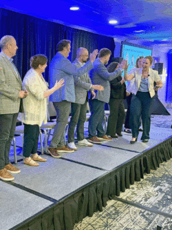 animated gif of Alyson Watson high-fiving a group of employees