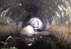 Interior of a stormwater culvert looking toward a daylight opening
